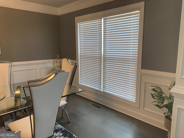 interior space with ornamental molding and dark hardwood / wood-style flooring