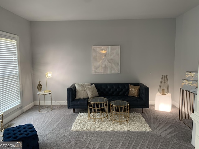 living room with plenty of natural light and carpet flooring