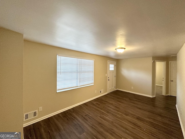 interior space with dark hardwood / wood-style flooring