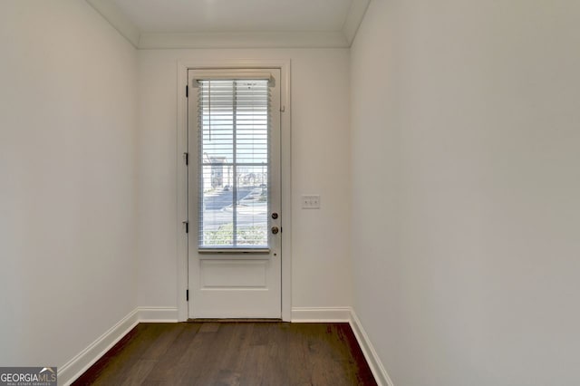 doorway to outside with dark hardwood / wood-style floors and ornamental molding