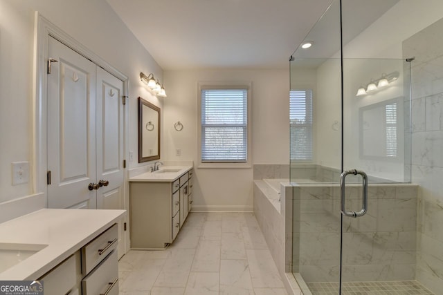 bathroom with vanity and independent shower and bath