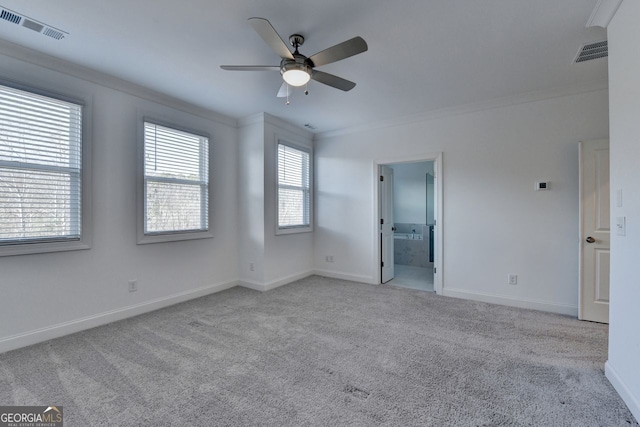 carpeted spare room with crown molding and ceiling fan