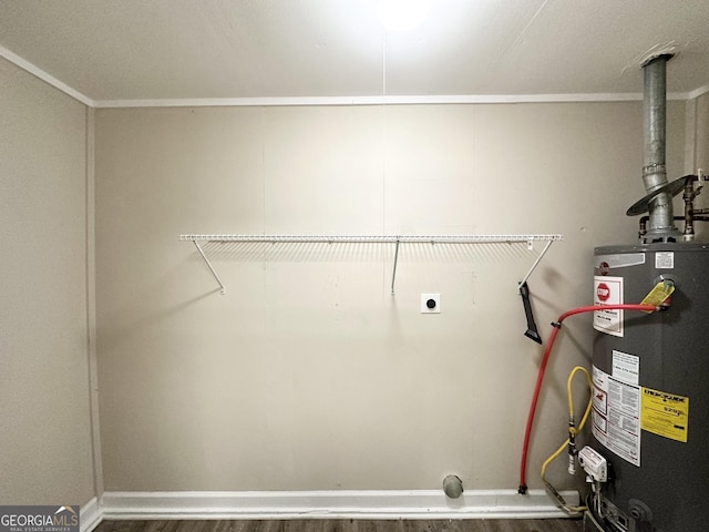 laundry room featuring dark hardwood / wood-style floors, electric dryer hookup, and water heater