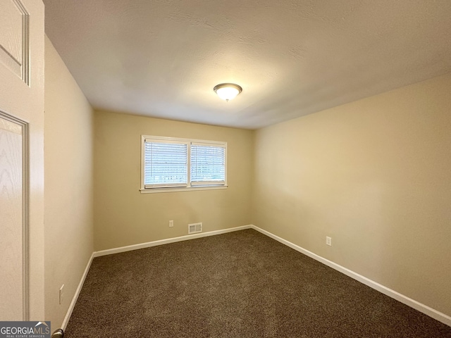 unfurnished room featuring carpet flooring