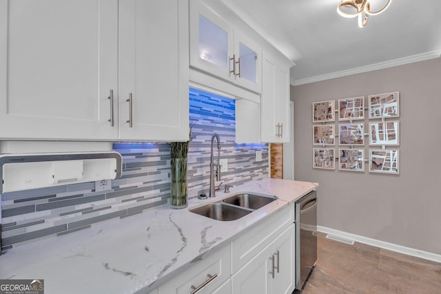 kitchen featuring sink, crown molding, dishwasher, light stone countertops, and white cabinets