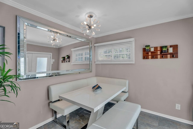 dining space with ornamental molding and a notable chandelier