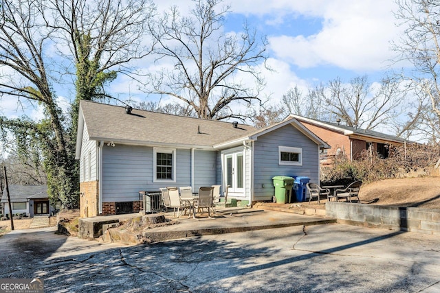 back of property featuring a patio area