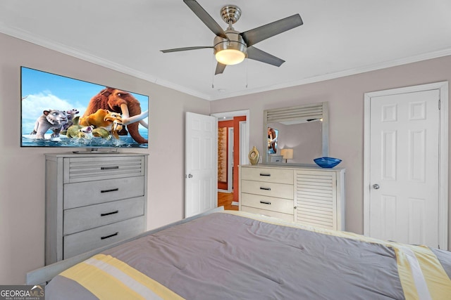 bedroom featuring ornamental molding and ceiling fan