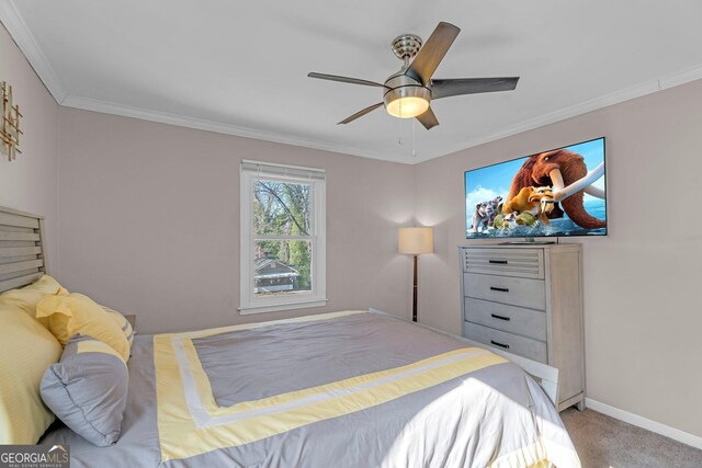 bedroom featuring crown molding, ceiling fan, and light colored carpet