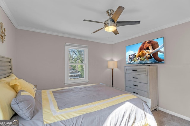 carpeted bedroom featuring crown molding and ceiling fan