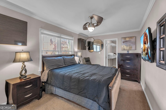 bedroom featuring crown molding, light colored carpet, and ensuite bath