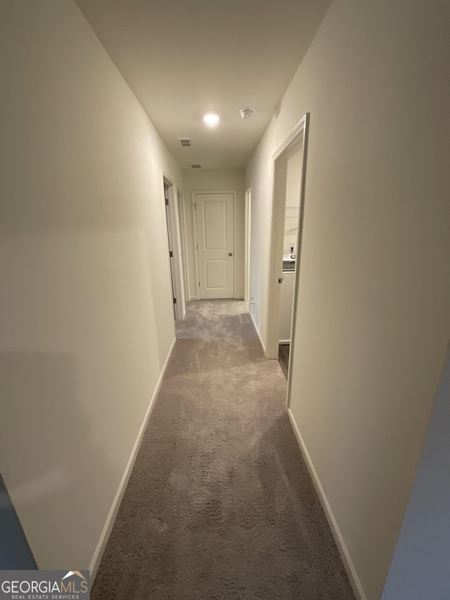 corridor with carpet floors