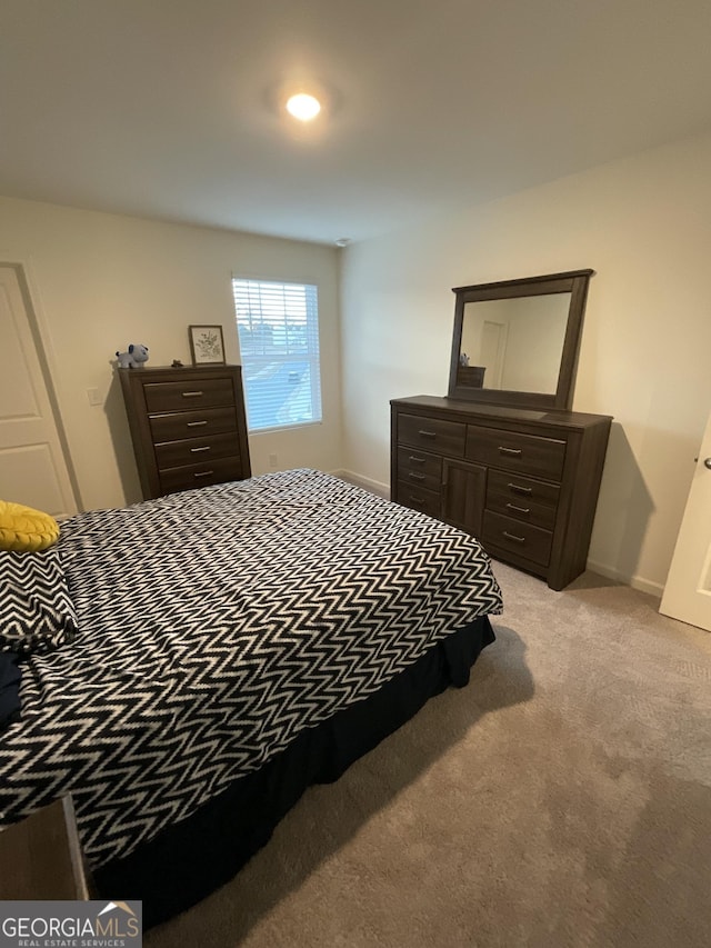 bedroom with light colored carpet