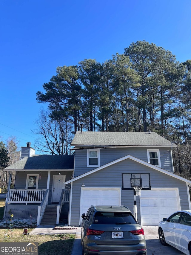 view of front of house with a porch and a garage