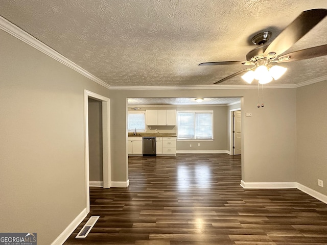 unfurnished living room featuring ceiling fan, sink, dark hardwood / wood-style flooring, a textured ceiling, and ornamental molding