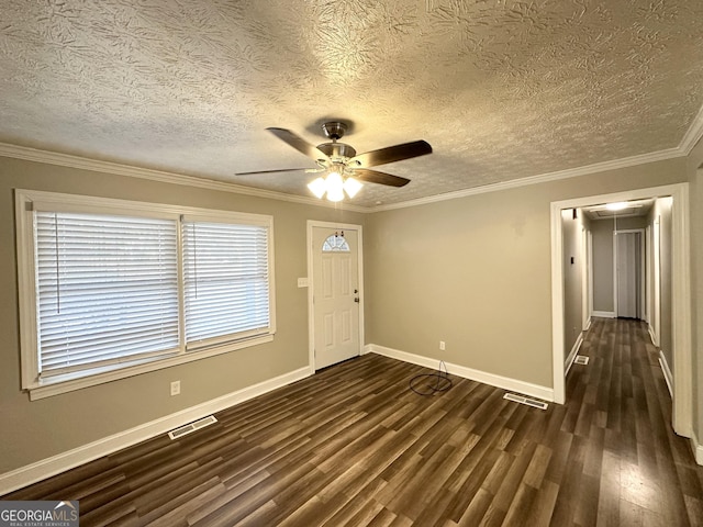 entrance foyer featuring dark hardwood / wood-style floors, ceiling fan, crown molding, and a textured ceiling