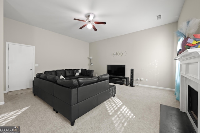 living room with ceiling fan and light colored carpet