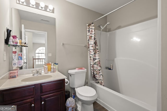 full bathroom with toilet, shower / tub combo, and vanity