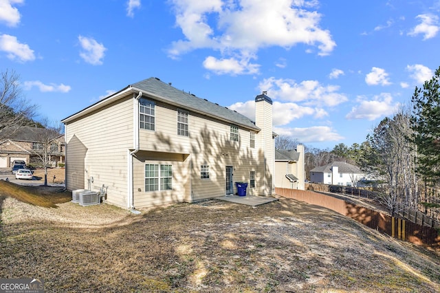 rear view of property featuring a patio area