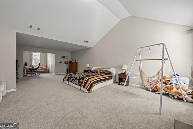 carpeted bedroom with vaulted ceiling