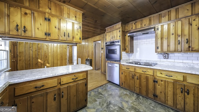 kitchen featuring decorative backsplash, wood ceiling, wooden walls, and black appliances