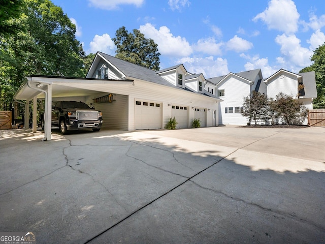 view of home's exterior with concrete driveway