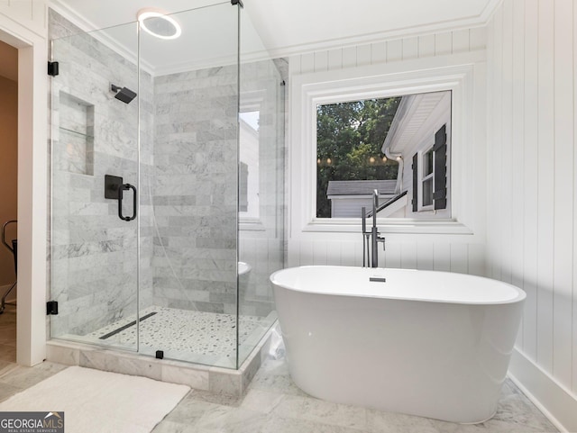 bathroom featuring shower with separate bathtub, wooden walls, and crown molding