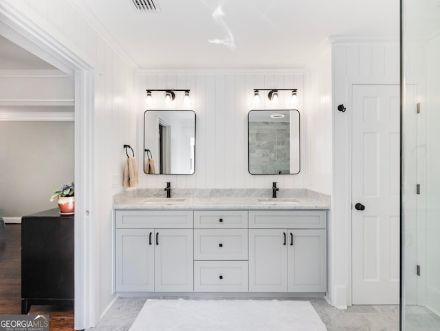 bathroom with vanity and crown molding