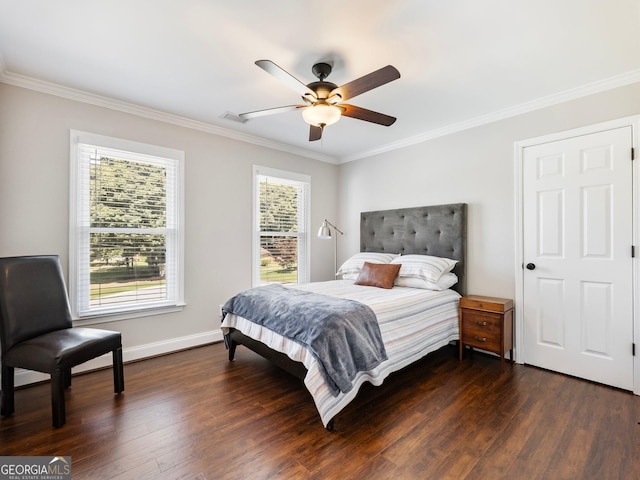 bedroom with dark wood-type flooring, visible vents, crown molding, and baseboards