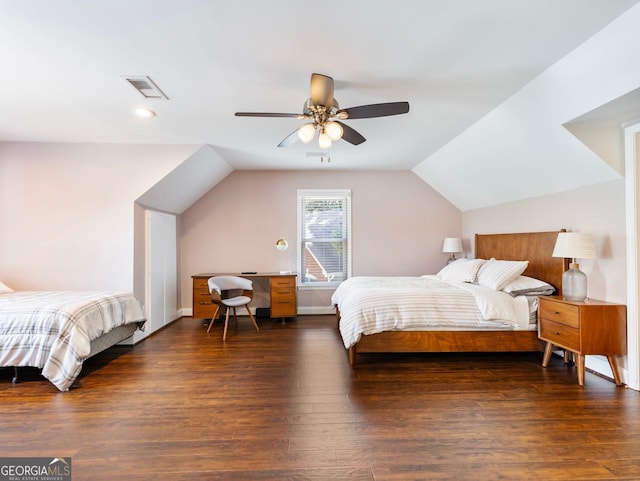 bedroom with ceiling fan, lofted ceiling, and dark hardwood / wood-style floors