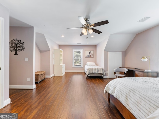 bedroom with dark hardwood / wood-style flooring, lofted ceiling, and ceiling fan