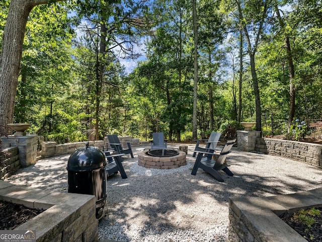 view of patio with an outdoor fire pit