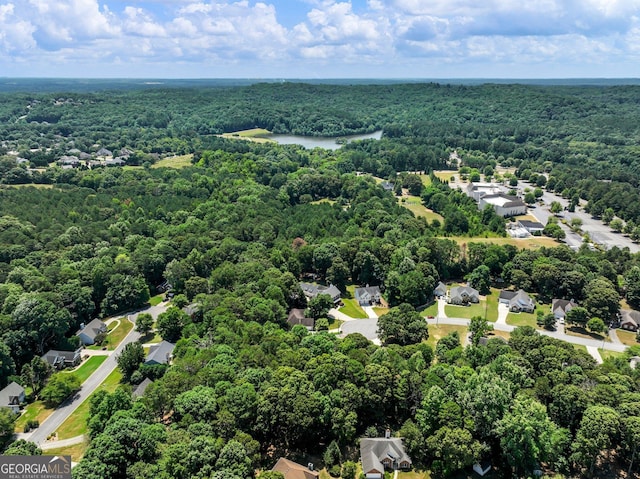 aerial view featuring a water view, a residential view, and a view of trees