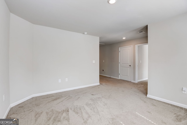 spare room featuring carpet floors