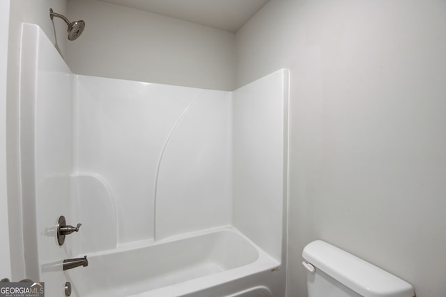 bathroom featuring  shower combination and toilet