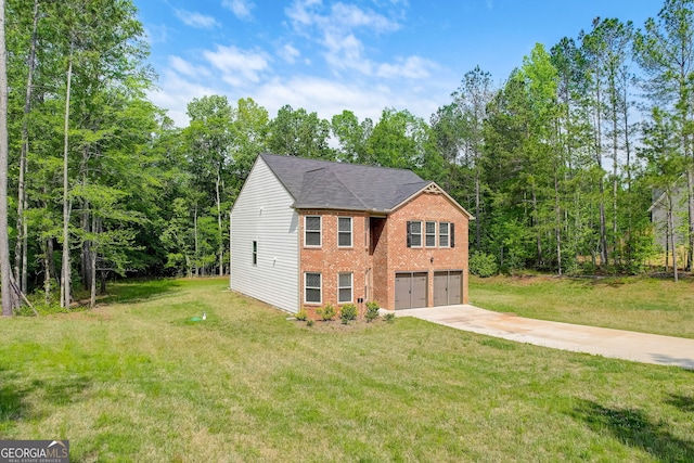 view of front of property with a garage and a front lawn