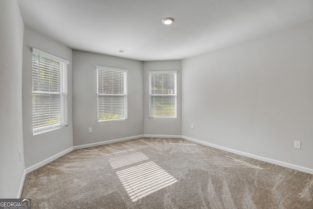 empty room with light colored carpet