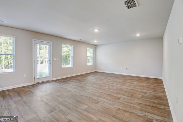 unfurnished room featuring light wood-type flooring