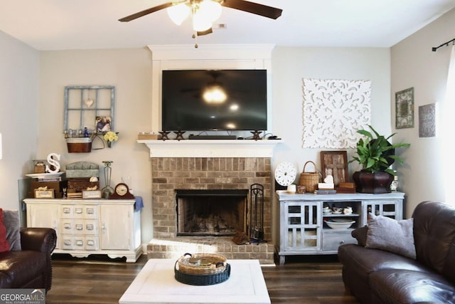 living room with a fireplace and dark hardwood / wood-style flooring