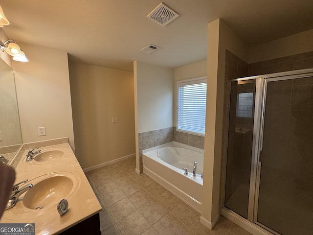 bathroom with shower with separate bathtub and vanity