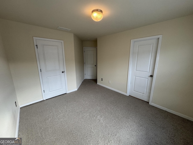 unfurnished bedroom with carpet flooring