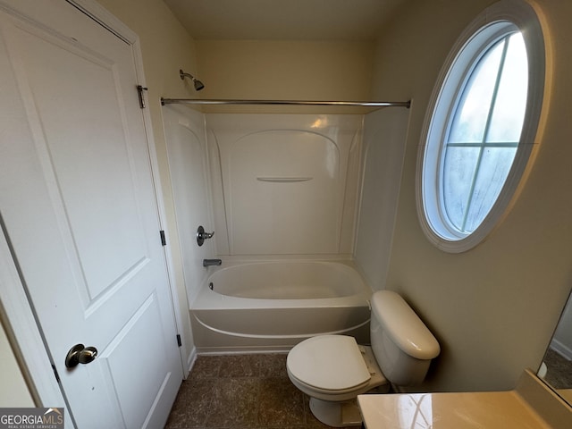 full bathroom featuring toilet, vanity, and tub / shower combination