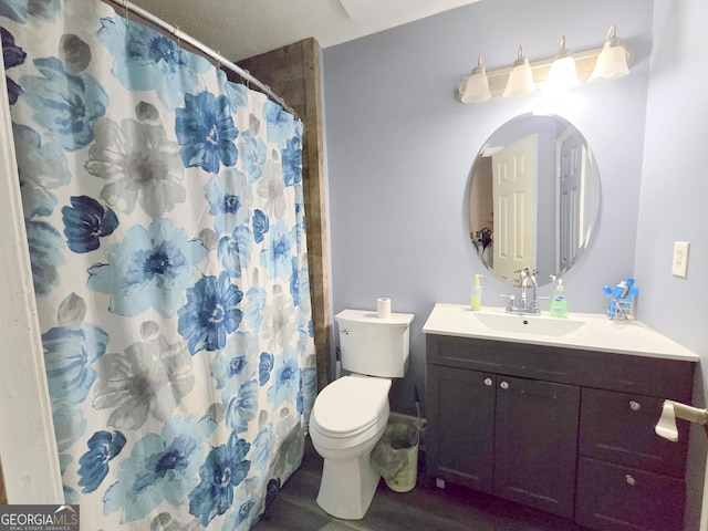 bathroom featuring a shower with shower curtain, wood-type flooring, vanity, and toilet