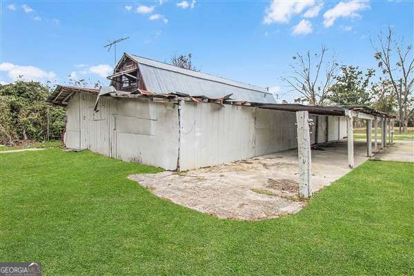 exterior space with an outbuilding and a yard