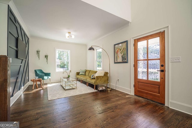 sitting room featuring dark hardwood / wood-style flooring and ornamental molding