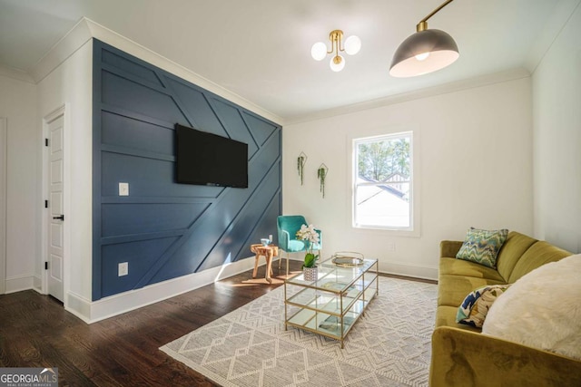 living room featuring hardwood / wood-style floors and crown molding