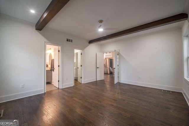 unfurnished bedroom with beamed ceiling, ensuite bathroom, dark hardwood / wood-style floors, and ceiling fan