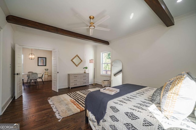 bedroom with beam ceiling, dark hardwood / wood-style floors, and ceiling fan with notable chandelier