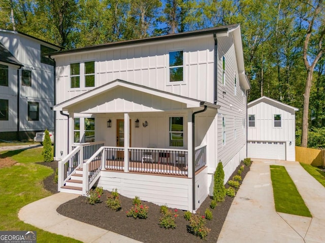 view of front facade featuring a porch and a garage