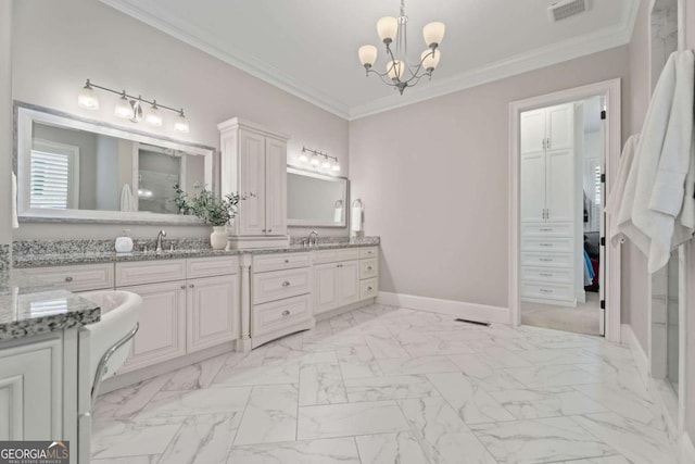 bathroom with vanity, ornamental molding, and an inviting chandelier